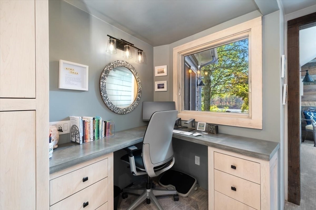 3 Howland Lane Hingham, MA 02043 - Photo 16 of 42 a view of a workspace room with a large window and mirror