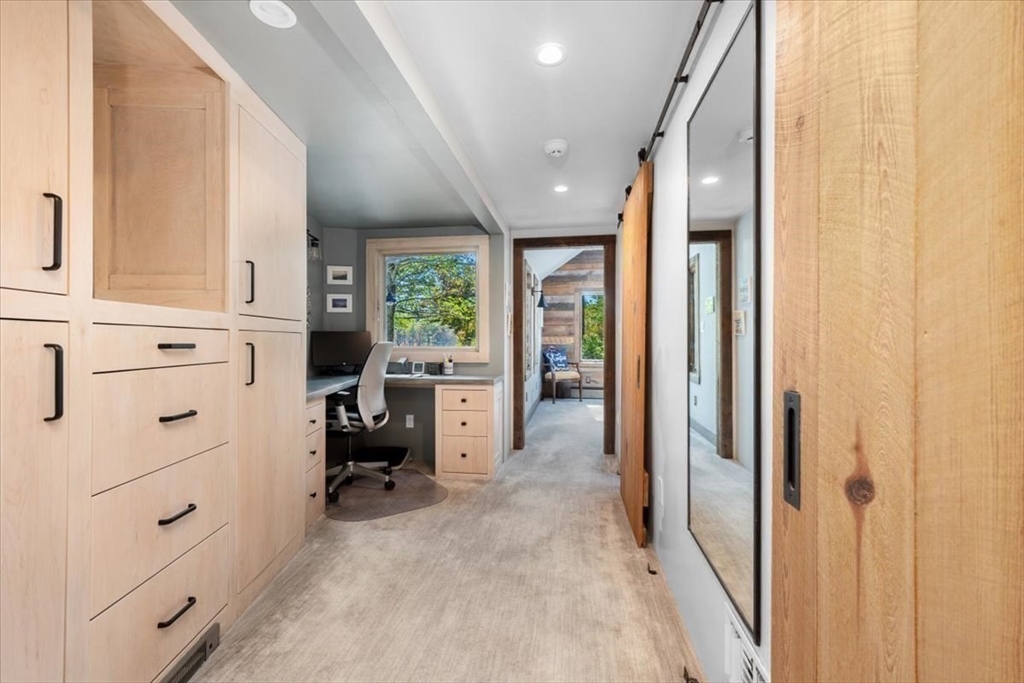 3 Howland Lane Hingham, MA 02043 - Photo 17 of 42 a view of a hallway with couch and a window