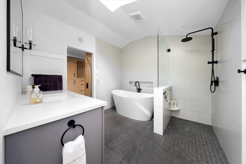 3 Howland Lane Hingham, MA 02043 - Photo 18 of 42 a living room with a couch and a table