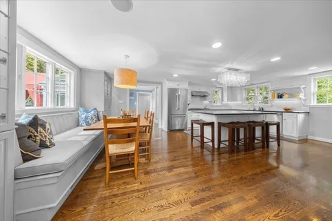 a living room with stainless steel appliances kitchen island granite countertop furniture and a kitchen view