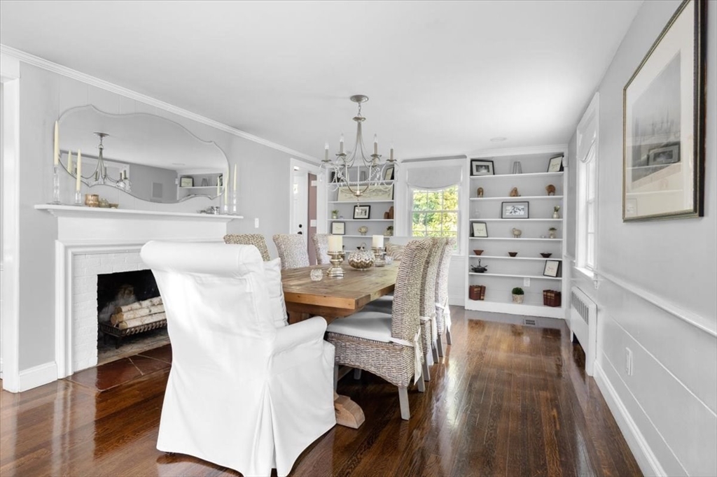 3 Howland Lane Hingham, MA 02043 - Photo 10 of 42 a living room with furniture a fireplace and wooden floor