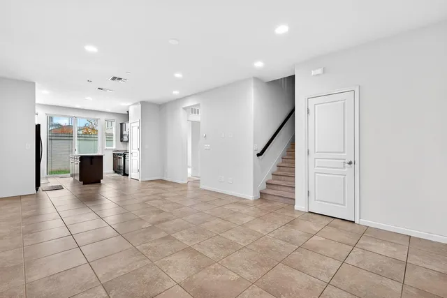 a view of a livingroom with an empty space and workspace