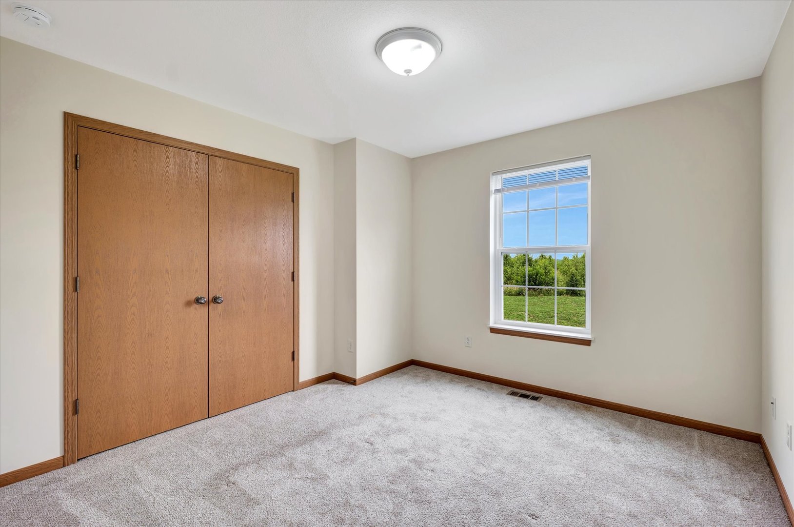 3315 Boulder Ridge Drive Champaign, IL 61822 - Photo 6 of 8 an empty room with windows and closet