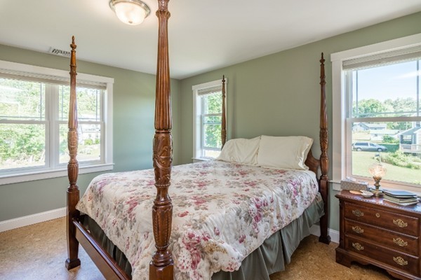 135 Marion Road Middleboro, MA 02346 - Photo 14 of 30 a bedroom with a bed and a dresser next to a window