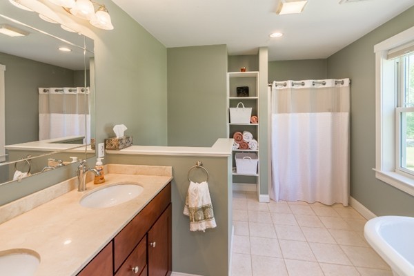 135 Marion Road Middleboro, MA 02346 - Photo 16 of 30 a bathroom with a sink double vanity and shower