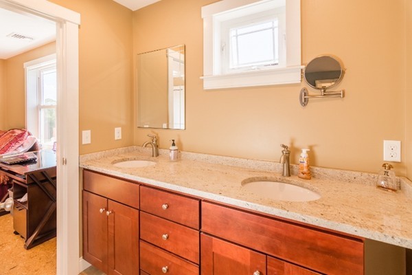 135 Marion Road Middleboro, MA 02346 - Photo 18 of 30 a bathroom with a sink double vanity and a window
