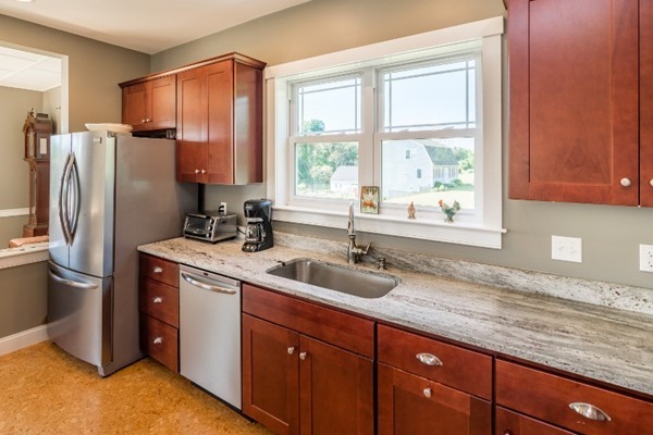 135 Marion Road Middleboro, MA 02346 - Photo 5 of 30 a kitchen with stainless steel appliances granite countertop a stove a refrigerator and a sink