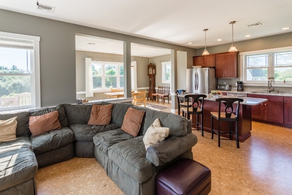 135 Marion Road Middleboro, MA 02346 - Photo 10 of 30 a living room with furniture kitchen view and a large window