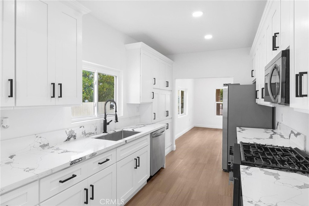 3882 Taft Street Riverside, CA 92503 - Photo 11 of 37 a spacious bathroom with double vanity a a sink a mirror and a shower