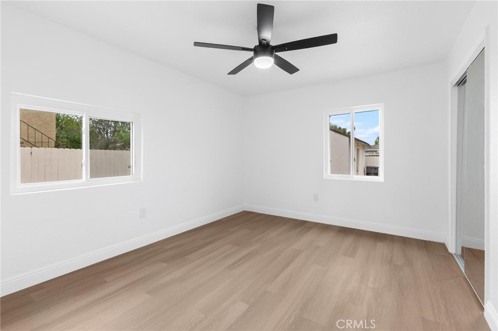 3882 Taft Street Riverside, CA 92503 - Photo 15 of 37 a view of an empty room with a window and wooden floor
