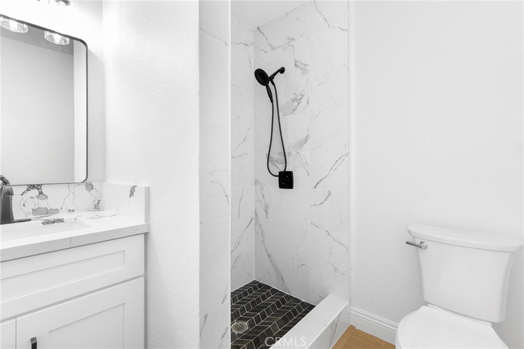 3882 Taft Street Riverside, CA 92503 - Photo 18 of 37 a bathroom with a toilet and a shower