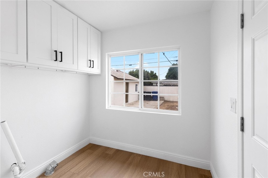 3882 Taft Street Riverside, CA 92503 - Photo 26 of 37 a view of wooden floor and windows in a room