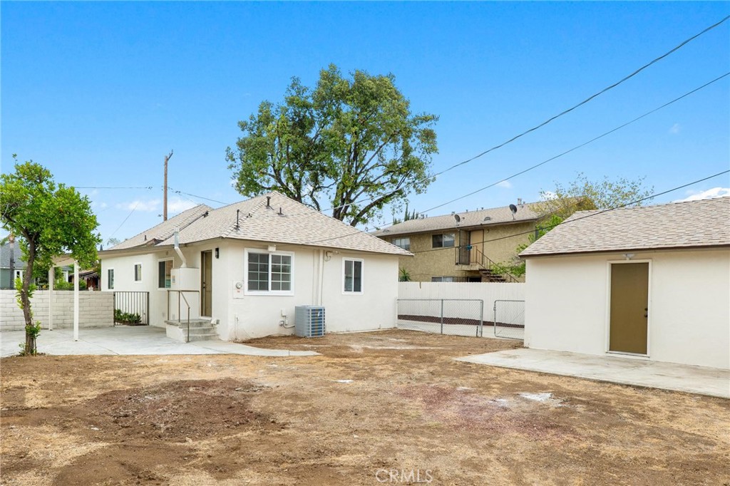 3882 Taft Street Riverside, CA 92503 - Photo 30 of 37 a front view of a house with a yard and garage