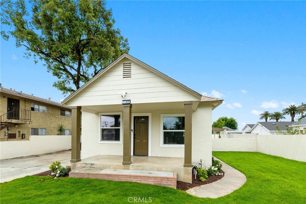 3882 Taft Street Riverside, CA 92503 - Photo 3 of 37 a front view of a house with a yard