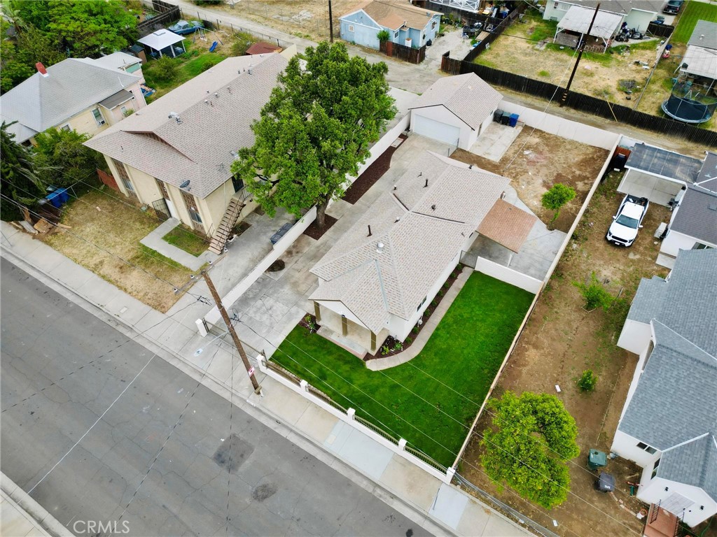 3882 Taft Street Riverside, CA 92503 - Photo 33 of 37 an aerial view of a house with a garden and trees