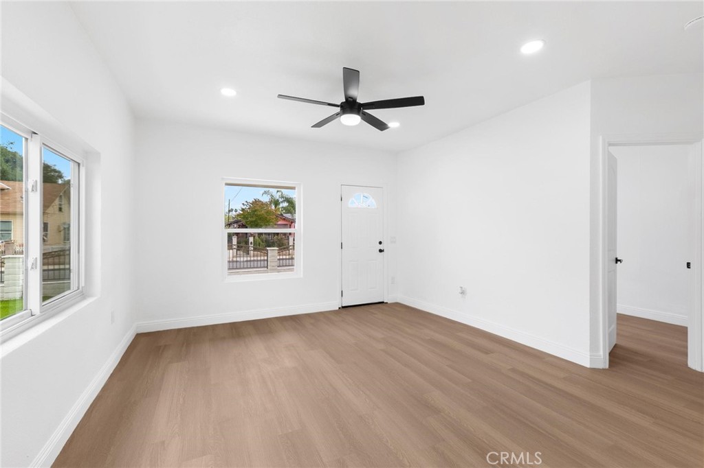 3882 Taft Street Riverside, CA 92503 - Photo 6 of 37 wooden floor in an empty room with a window