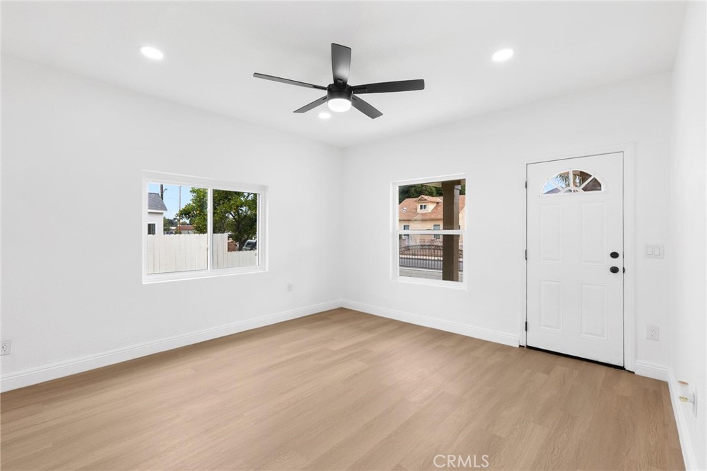 3882 Taft Street Riverside, CA 92503 - Photo 7 of 37 wooden floor in an empty room with a window