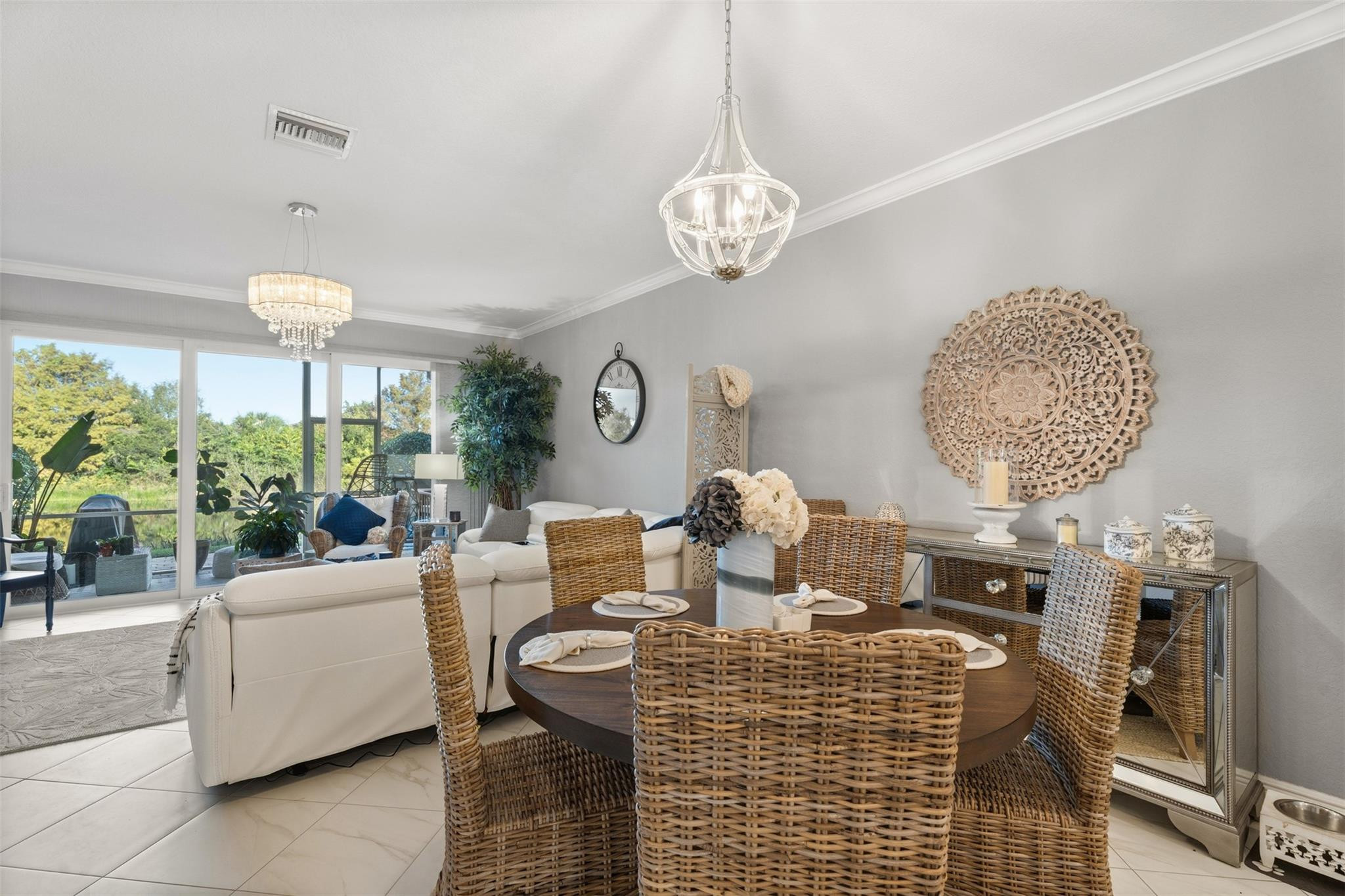 651 Southwest Glen Crest Way, Unit 2 Stuart, FL 34997 - Photo 11 of 41 a living room with furniture a chandelier and a fireplace