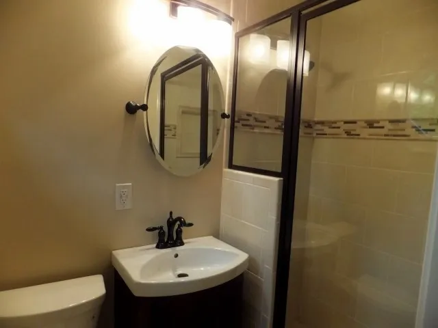 a bathroom with a sink and mirror