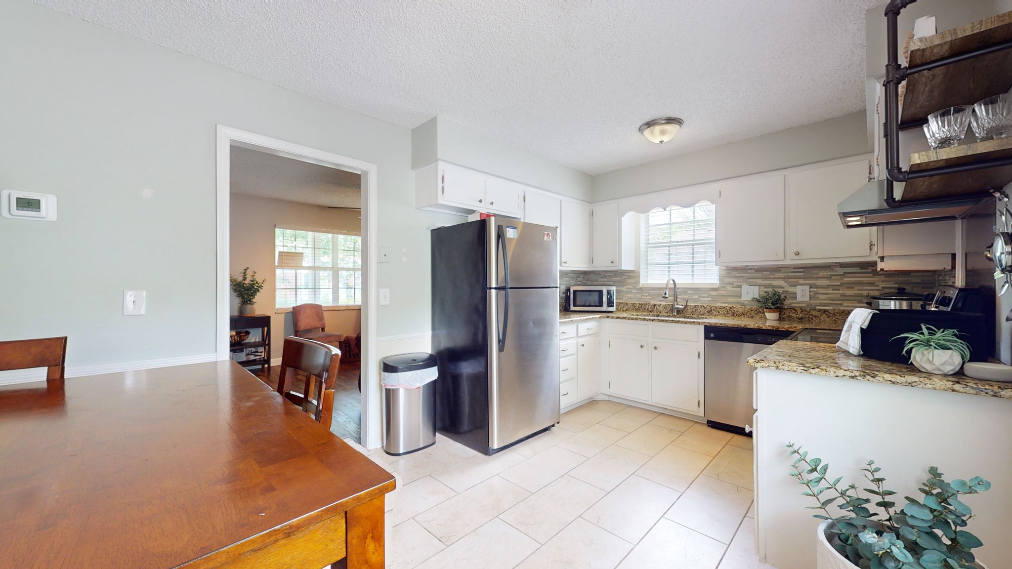 3229 New Towne Road Antioch, TN 37013 - Photo 7 of 35 a kitchen with refrigerator and cabinets