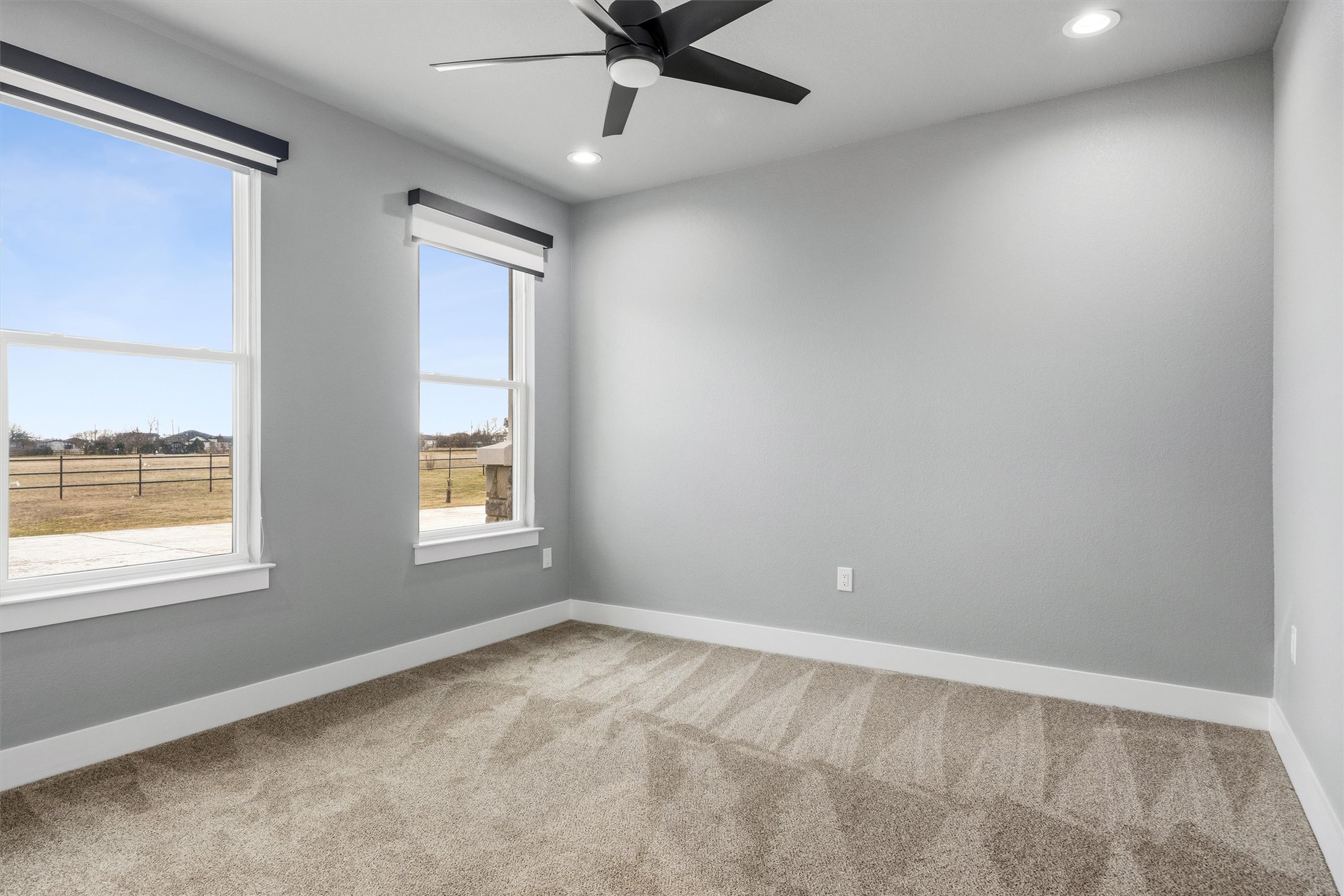 178 Balch Road Elgin, TX 78621 - Photo 25 of 40 an empty room with a window and a ceiling fan
