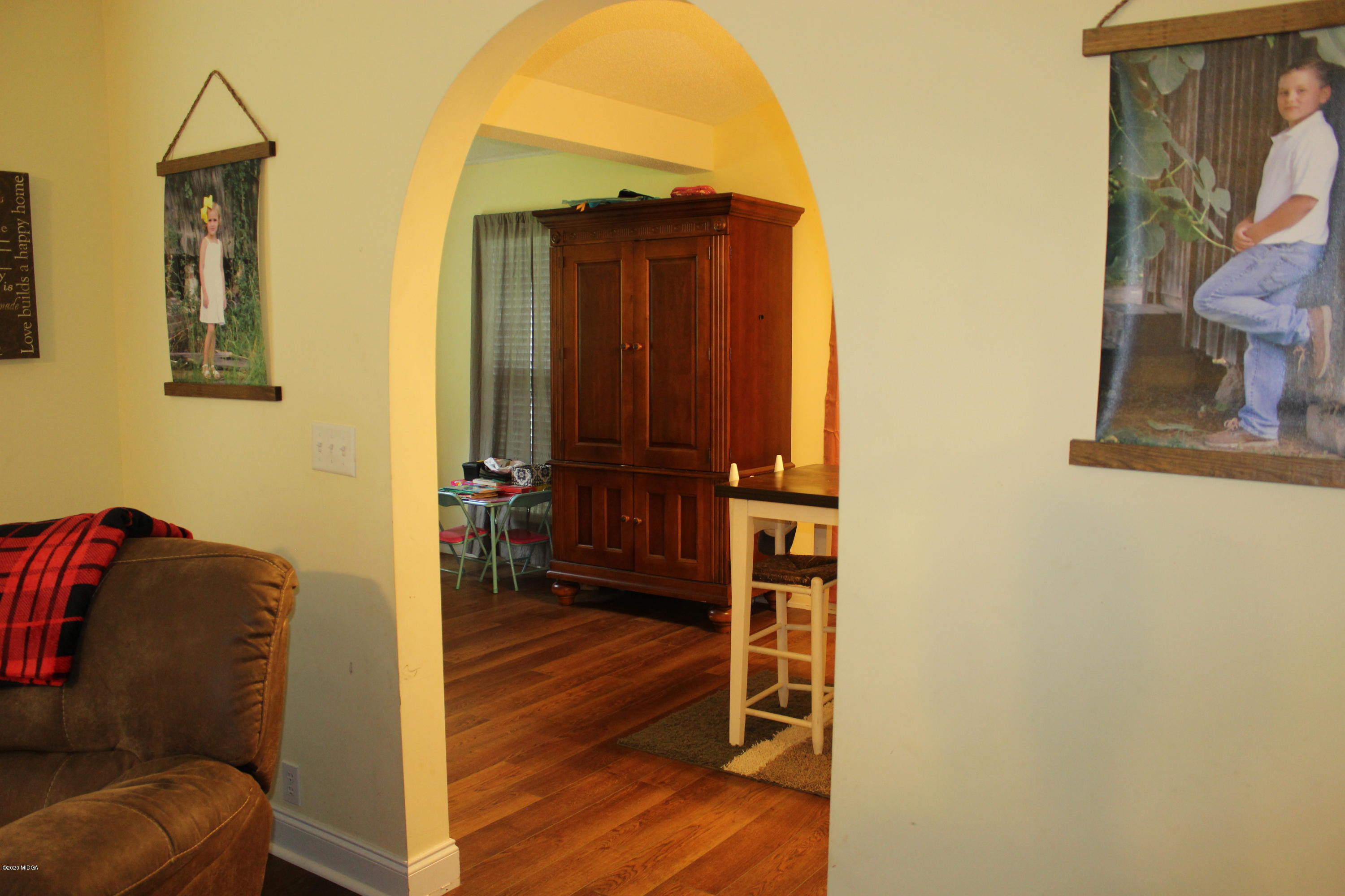 75 Jenkins Road Forsyth, GA 31029 - Photo 4 of 15 a view of hallway with wooden floor