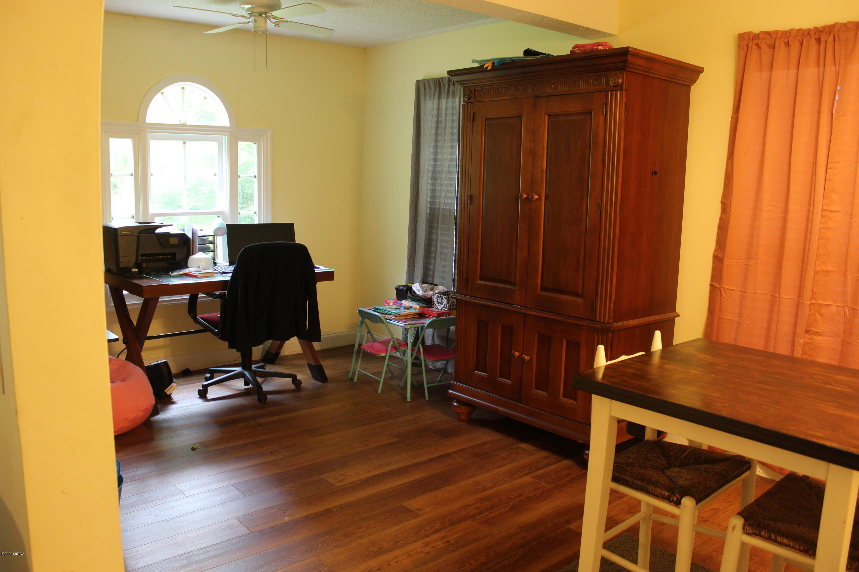 75 Jenkins Road Forsyth, GA 31029 - Photo 5 of 15 a view of a workspace with furniture and a window