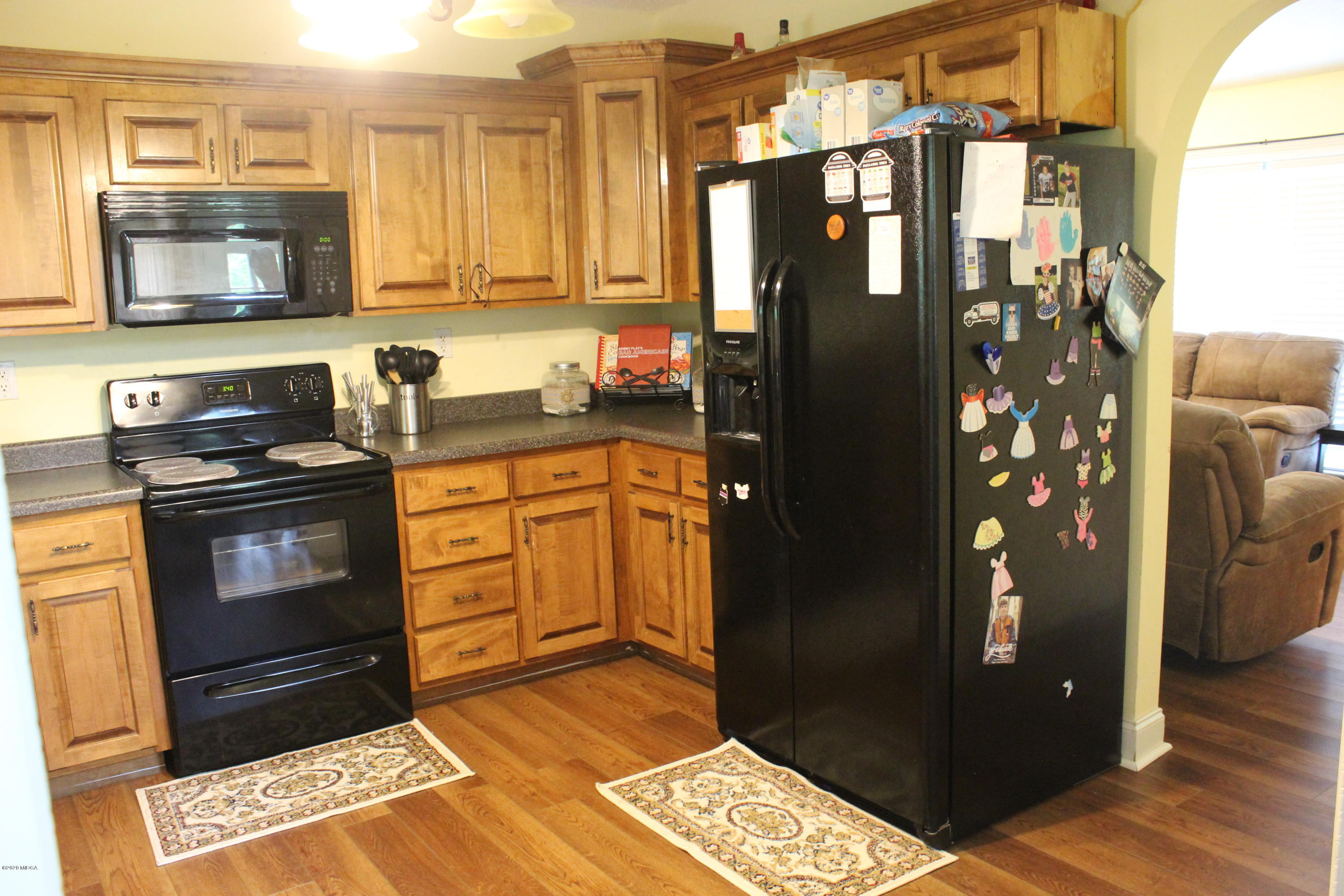 75 Jenkins Road Forsyth, GA 31029 - Photo 8 of 15 a kitchen with granite countertop a refrigerator and a stove