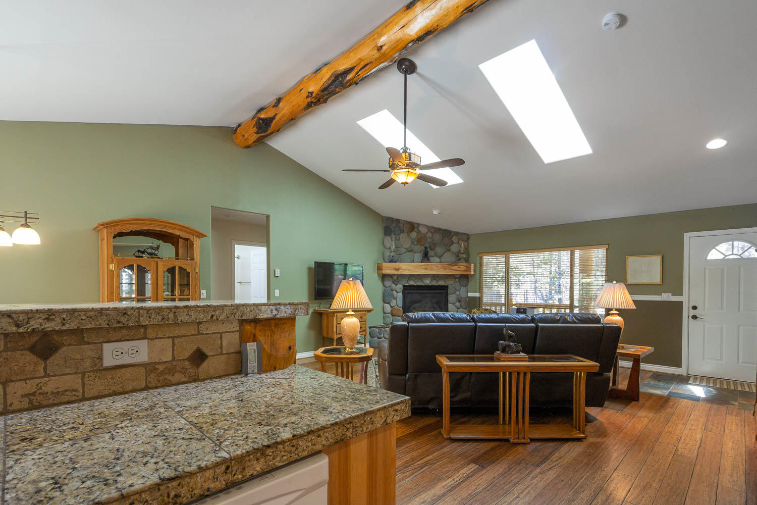 17151 Merced Road Bend, OR 97707 - Photo 16 of 30 a living room with furniture and a flat screen tv