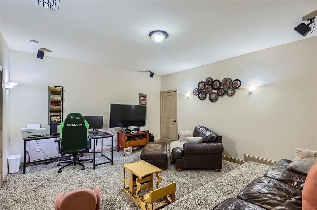 813 Goose Court Forney, TX 75126 - Photo 23 of 28 a living room with furniture