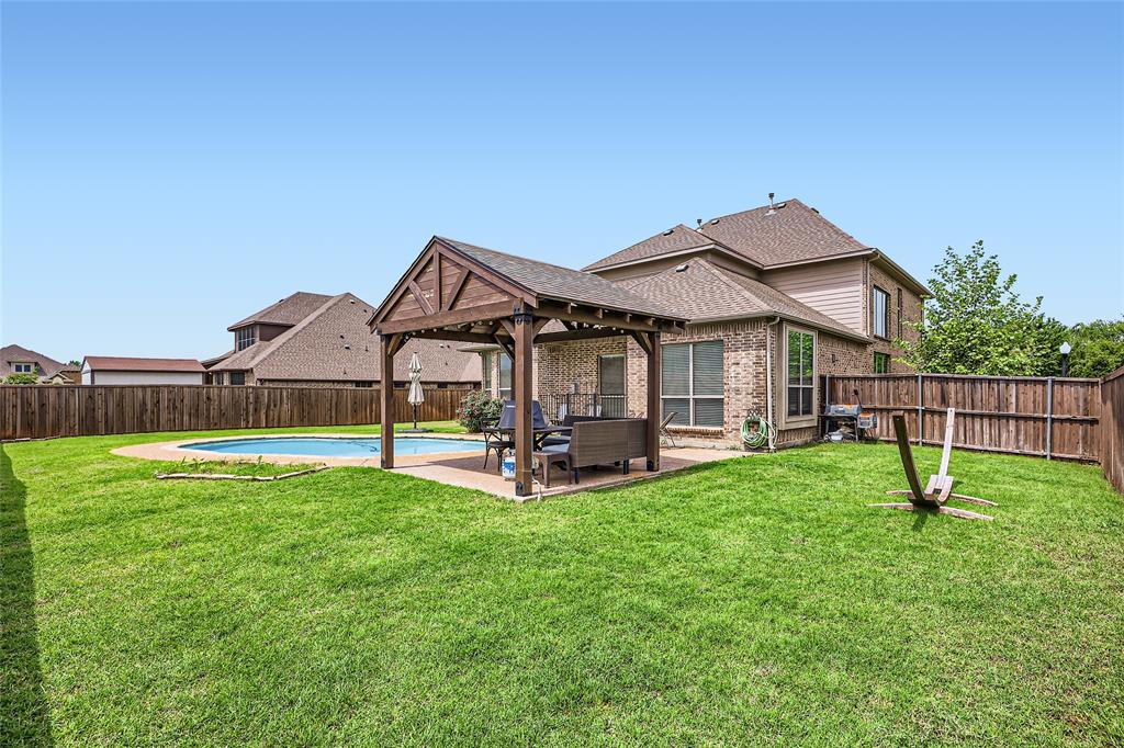 813 Goose Court Forney, TX 75126 - Photo 27 of 28 a view of a house with a yard and sitting area