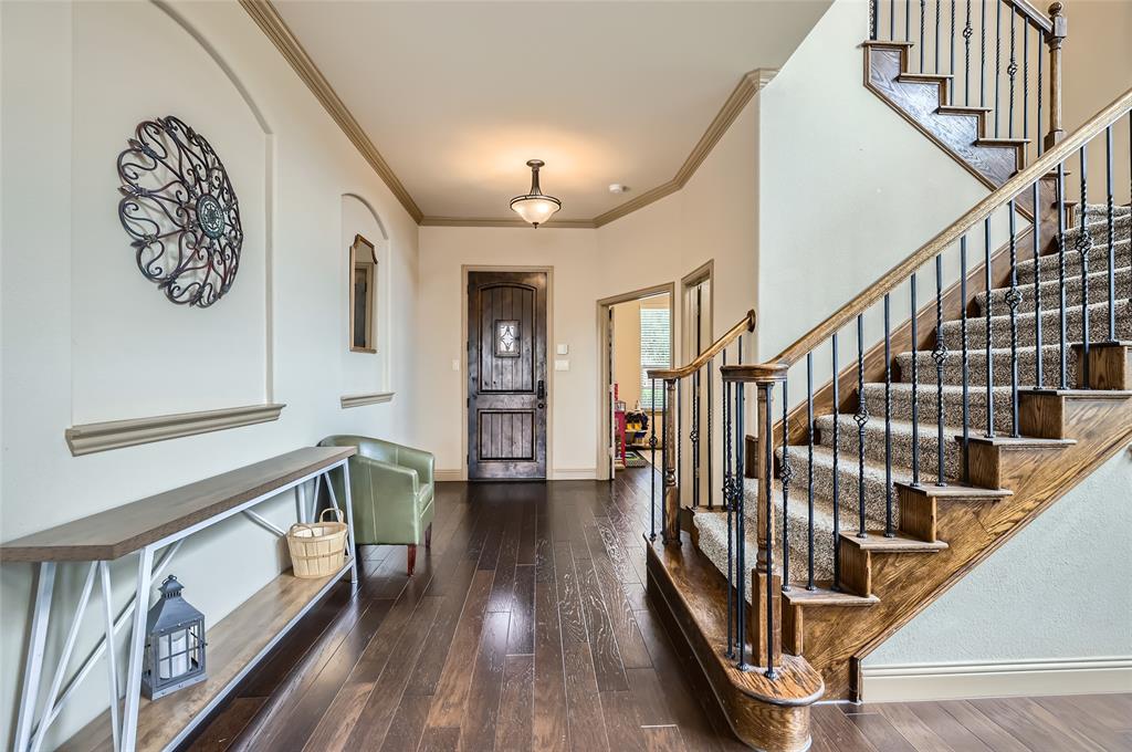 813 Goose Court Forney, TX 75126 - Photo 4 of 28 a view of entryway with wooden floor and stairs