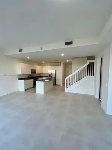 a view of a kitchen with a sink