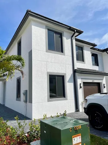 a front view of a house with yard