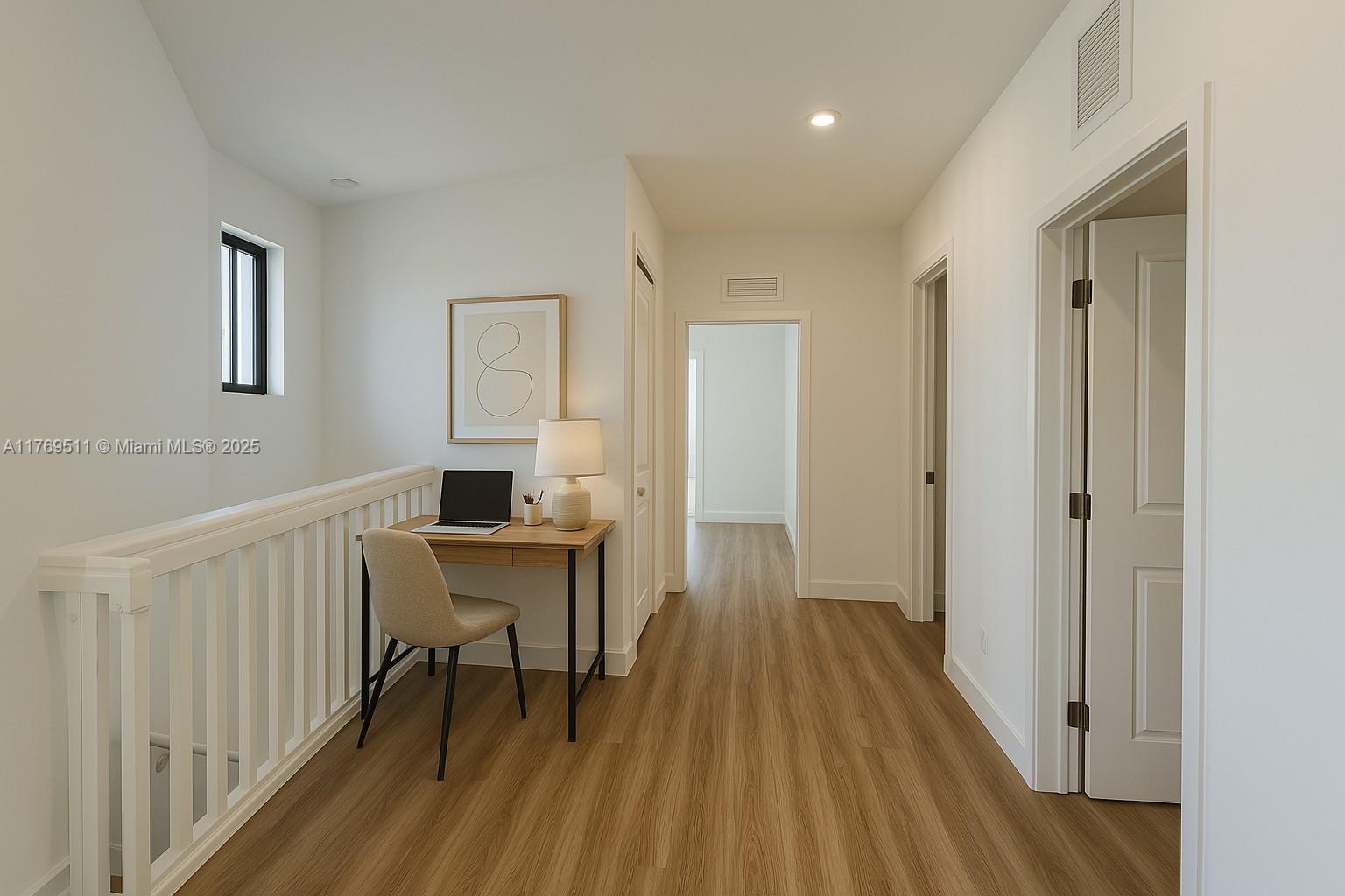 18995 Southwest 345th Terrace Homestead, FL 33034 - Photo 8 of 21 a view of a room with wooden floor windows a ceiling fan and windows