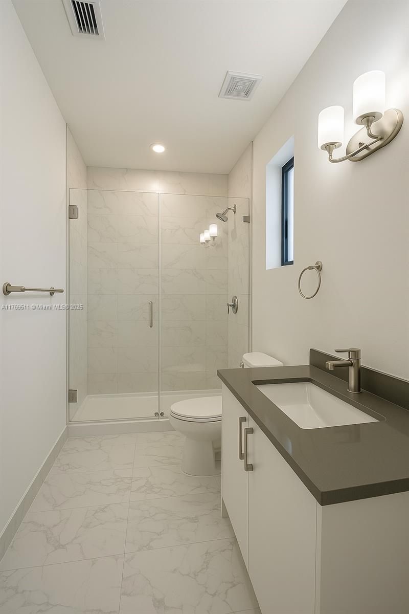 18995 Southwest 345th Terrace Homestead, FL 33034 - Photo 9 of 21 a bathroom with a sink a toilet and shower