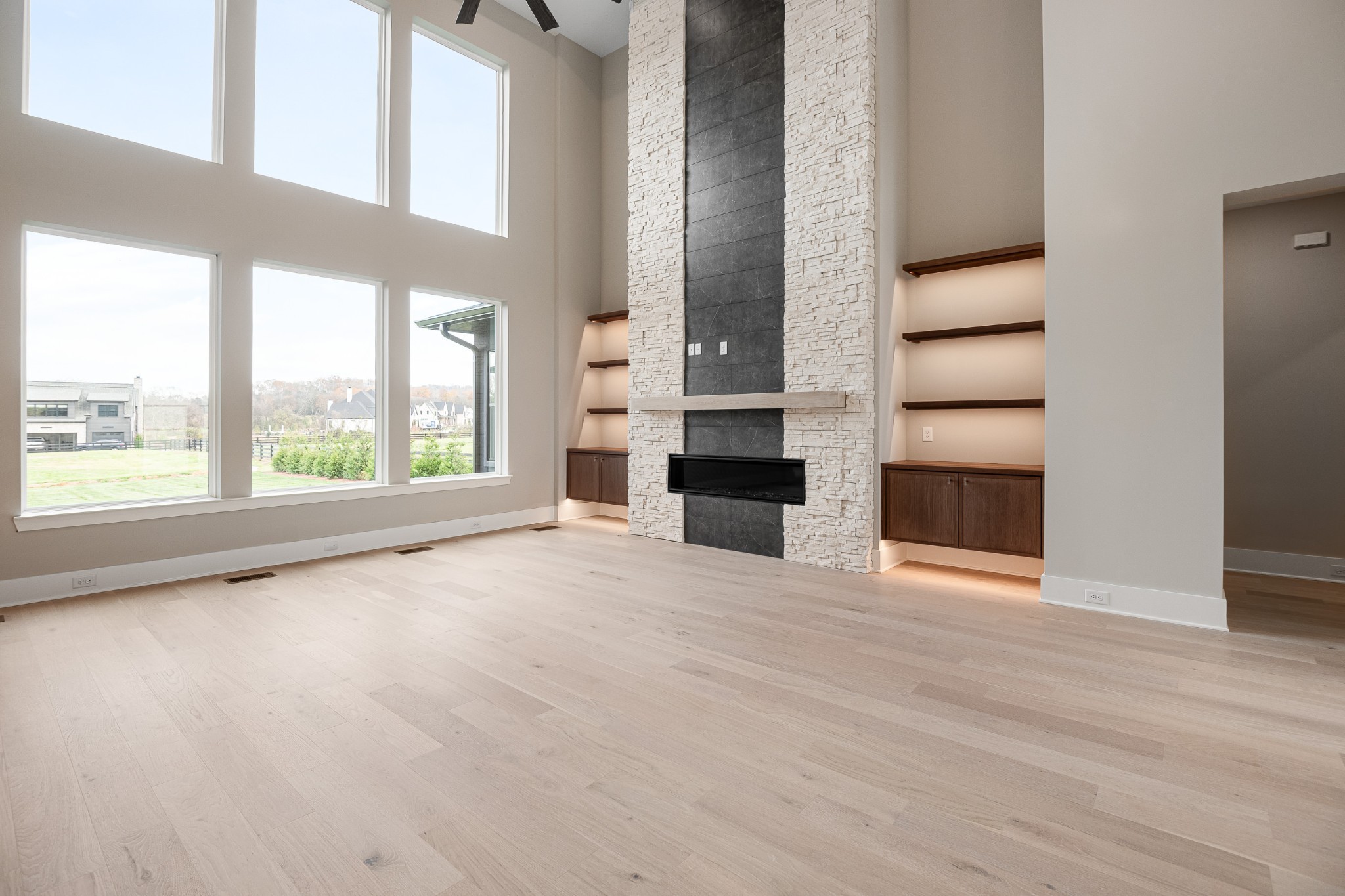 1764 Dean Road Thompson's Station, TN 37179 - Photo 12 of 45 an empty room with windows and fireplace
