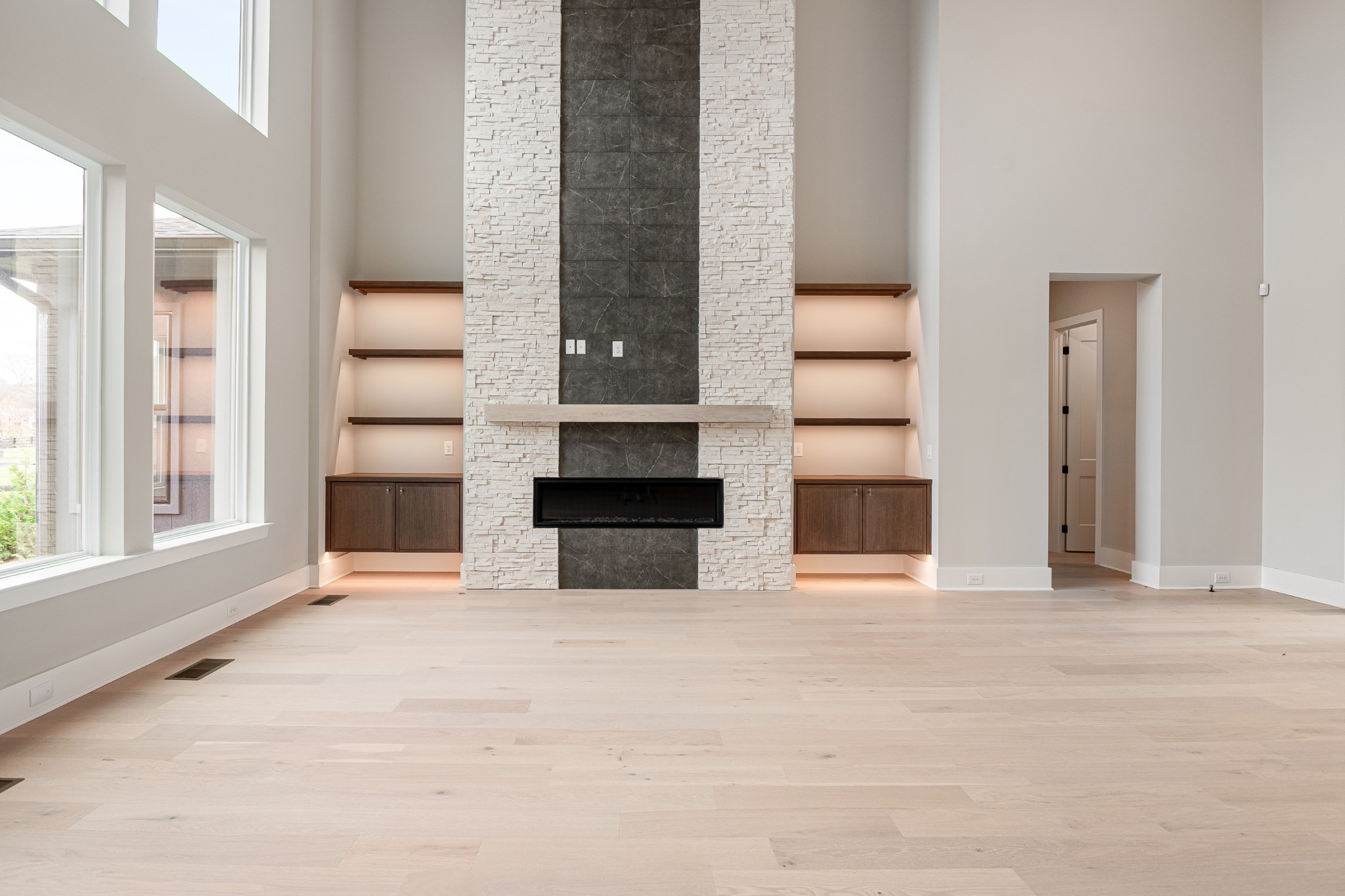 1764 Dean Road Thompson's Station, TN 37179 - Photo 14 of 45 a view of an empty room with a fireplace and windows