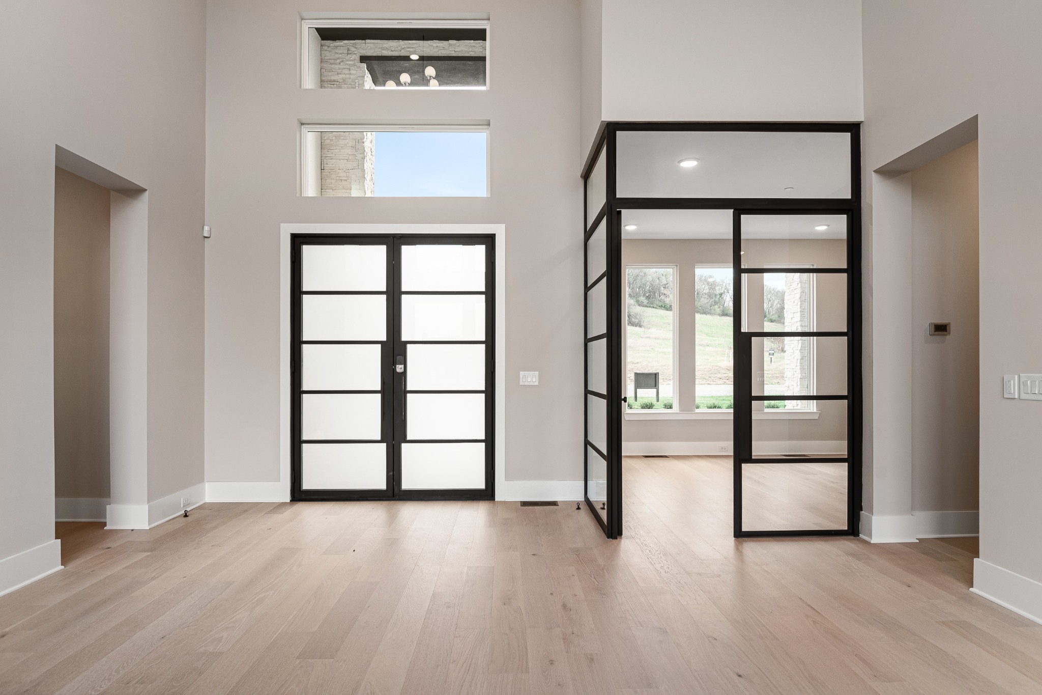 1764 Dean Road Thompson's Station, TN 37179 - Photo 15 of 45 an empty room with wooden floor and windows