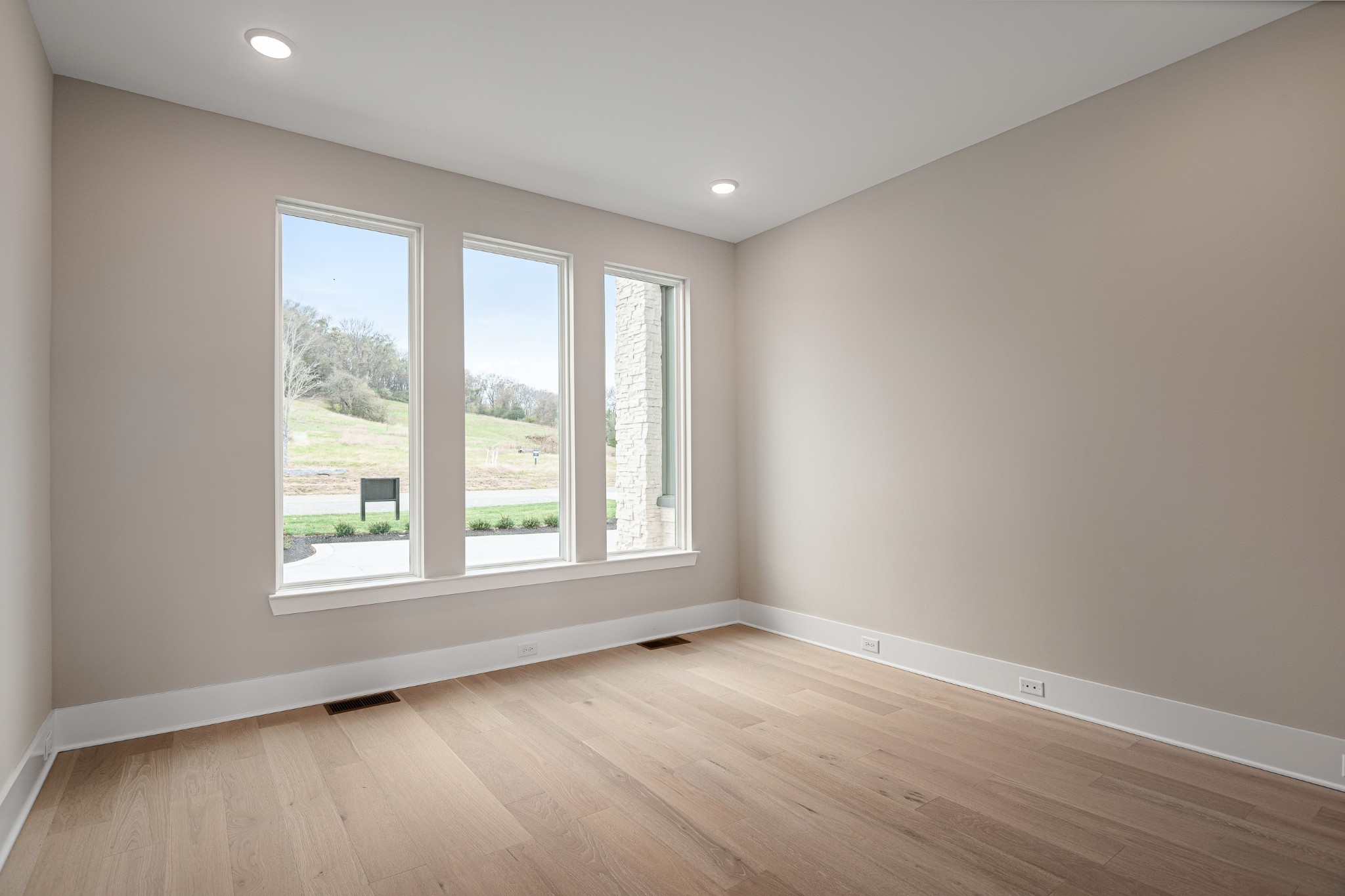 1764 Dean Road Thompson's Station, TN 37179 - Photo 17 of 45 an empty room with wooden floor and windows