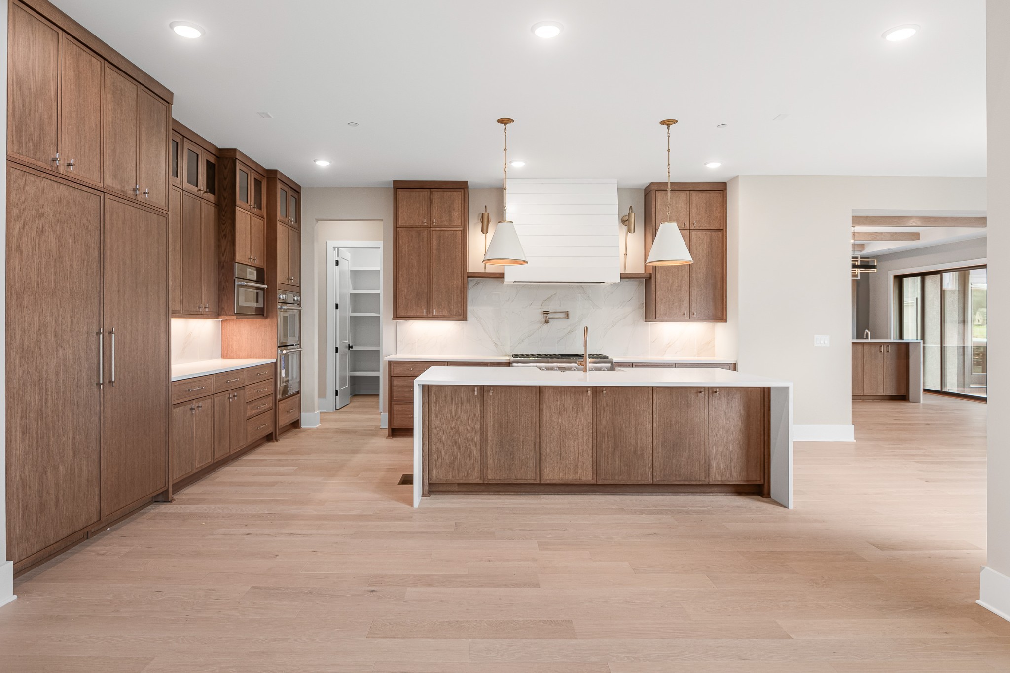 1764 Dean Road Thompson's Station, TN 37179 - Photo 18 of 45 a large kitchen with kitchen island a sink stainless steel appliances and cabinets