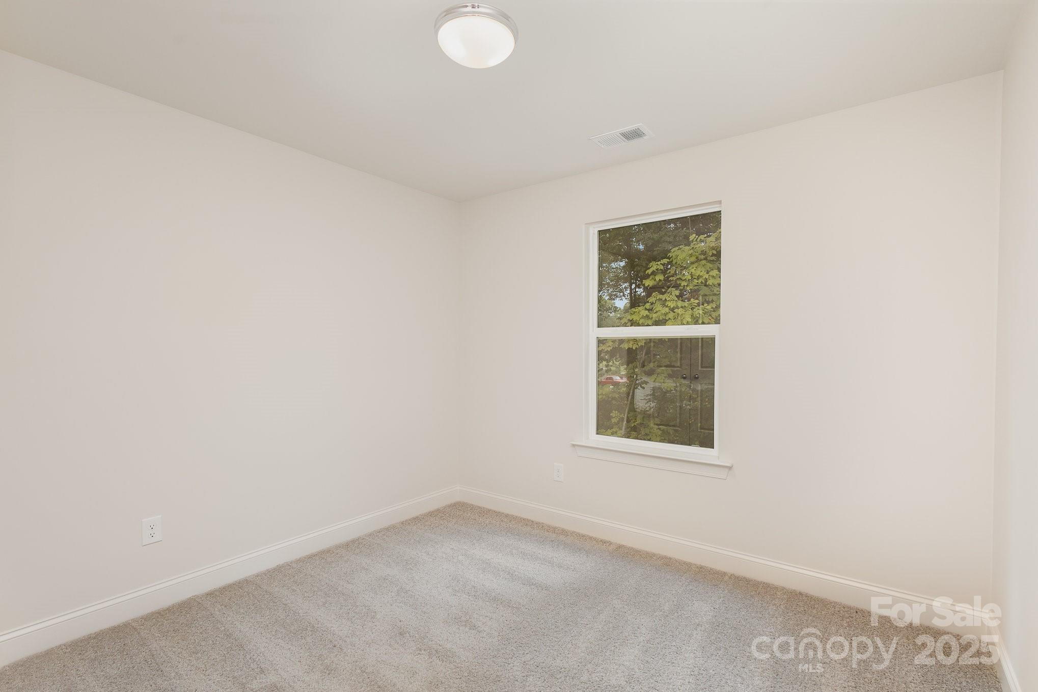 19901 Burton Lane Cornelius, NC 28031 - Photo 18 of 28 an empty room with a window