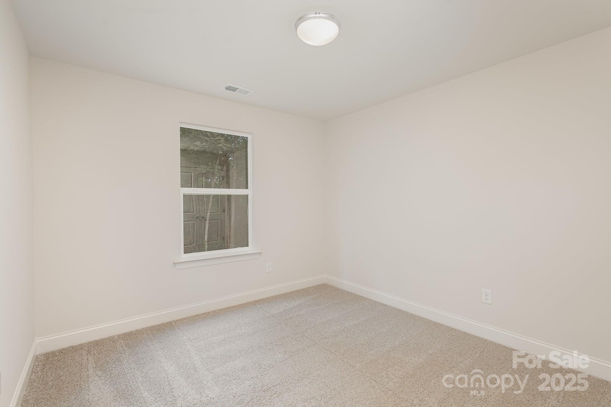 19901 Burton Lane Cornelius, NC 28031 - Photo 20 of 28 an empty room with a window
