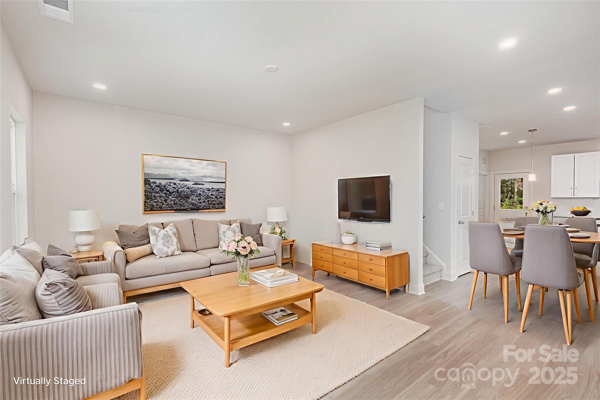 19901 Burton Lane Cornelius, NC 28031 - Photo 2 of 28 a living room with furniture and a flat screen tv