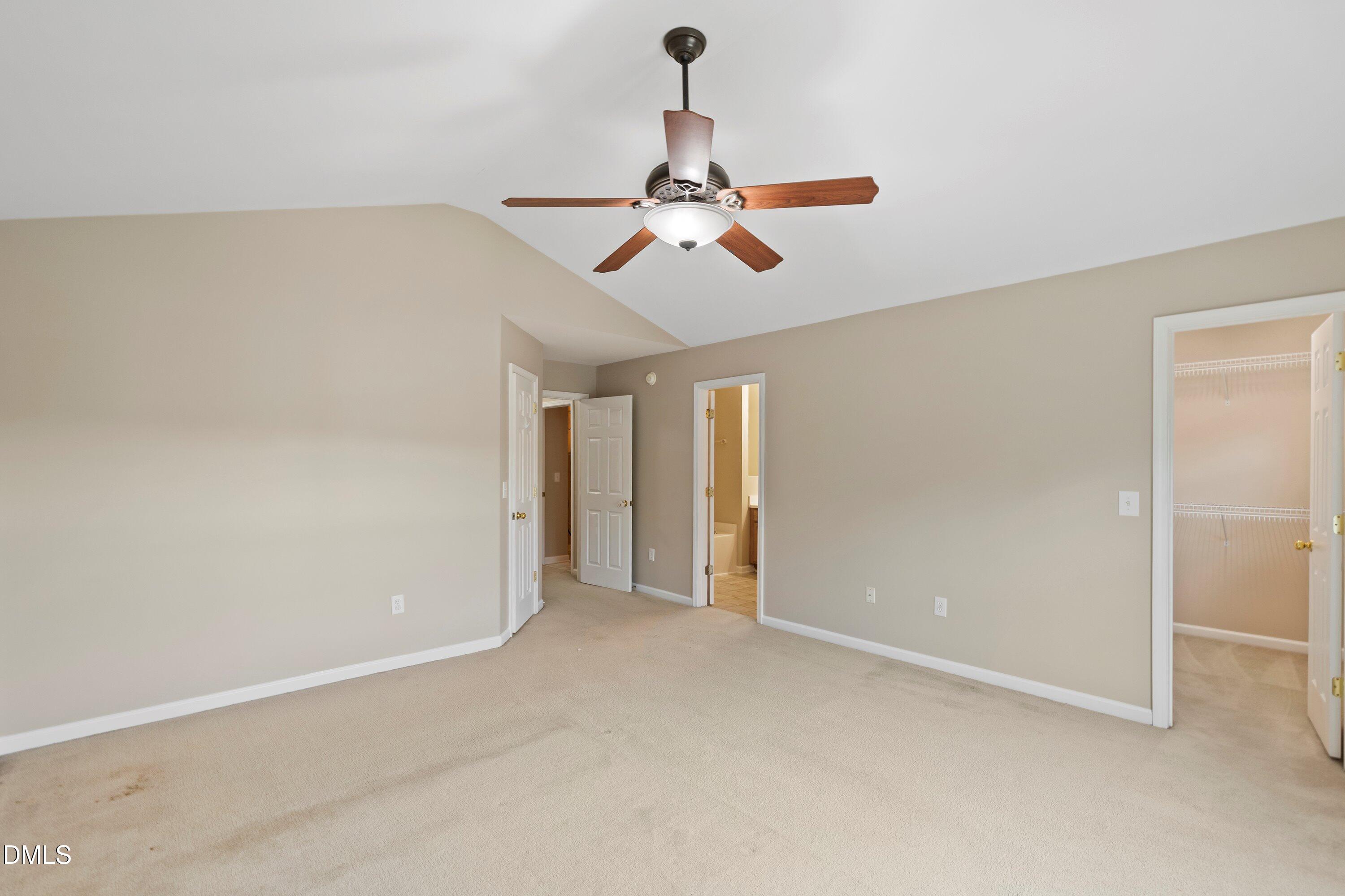 11 Kinglet Court Durham, NC 27713 - Photo 16 of 32 an empty room with chandelier fan
