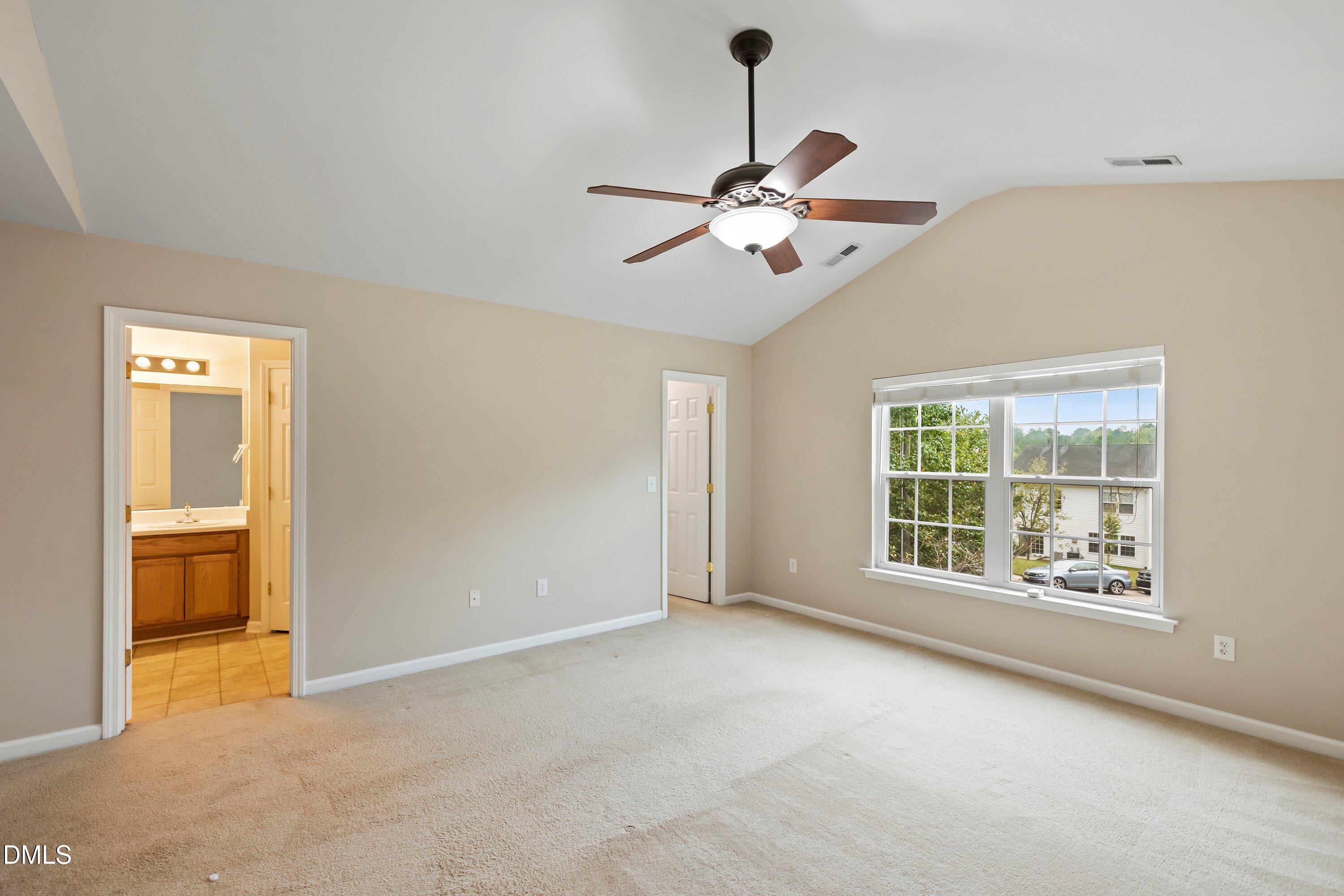 11 Kinglet Court Durham, NC 27713 - Photo 17 of 32 a view of an empty room with a window
