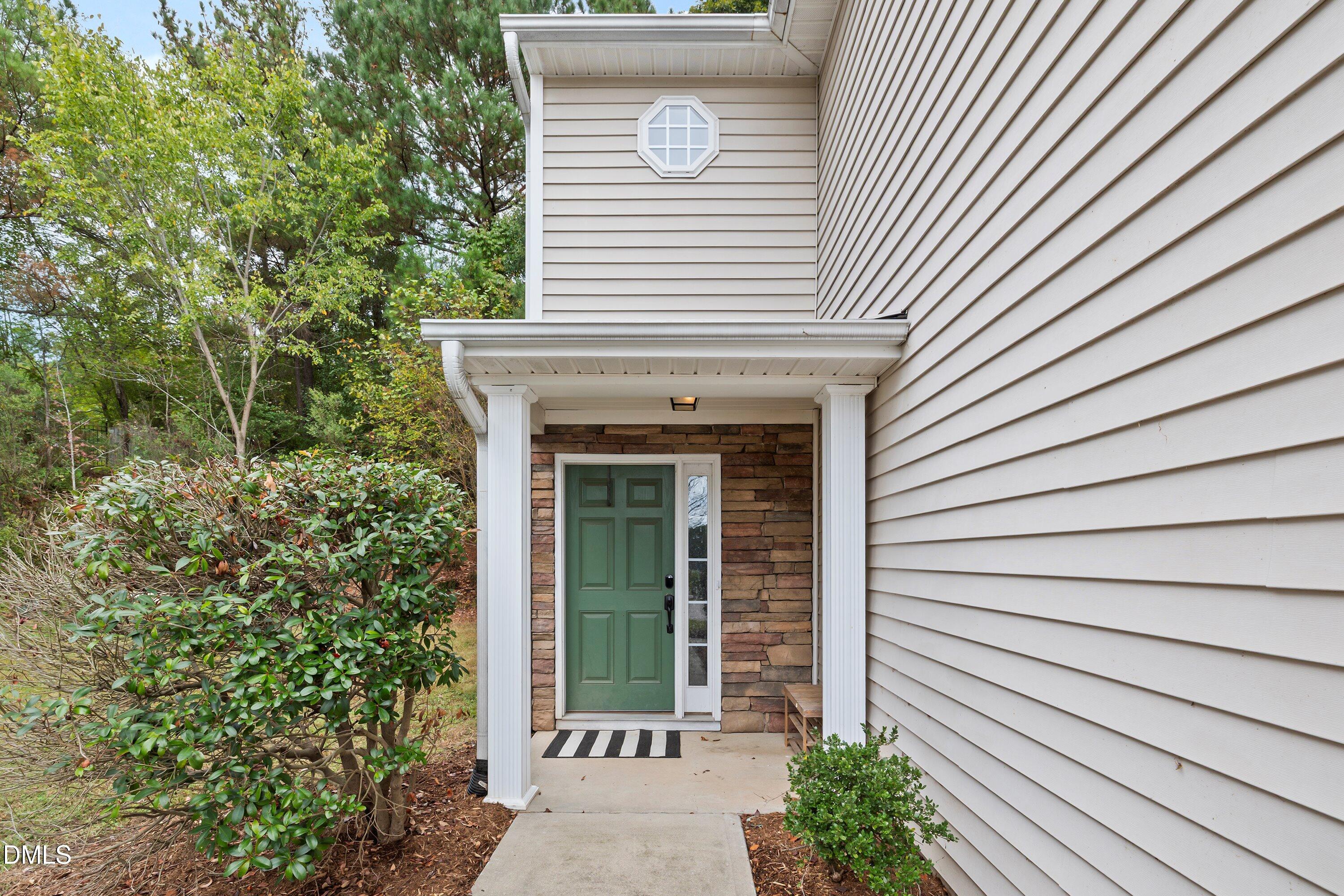 11 Kinglet Court Durham, NC 27713 - Photo 3 of 32 a front view of a house with a garden