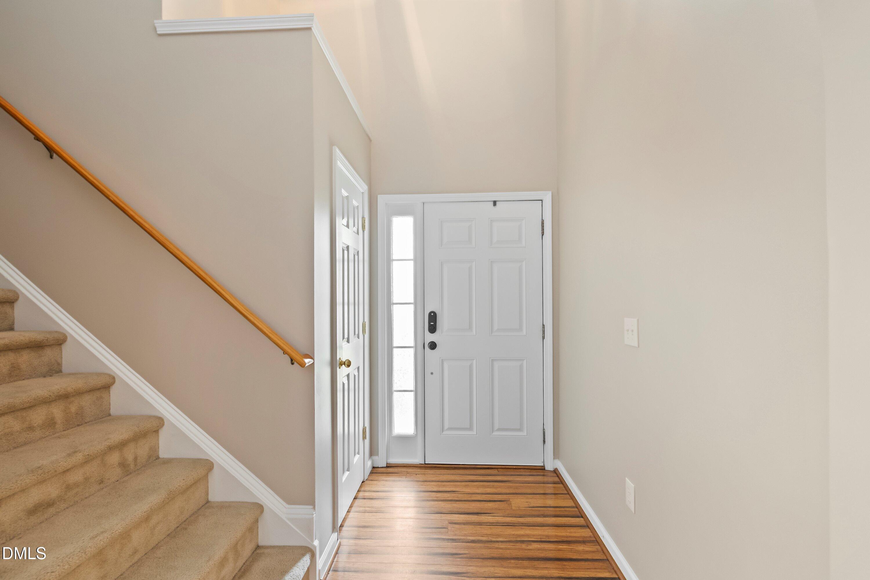 11 Kinglet Court Durham, NC 27713 - Photo 4 of 32 a view of a hallway with wooden floor and entryway