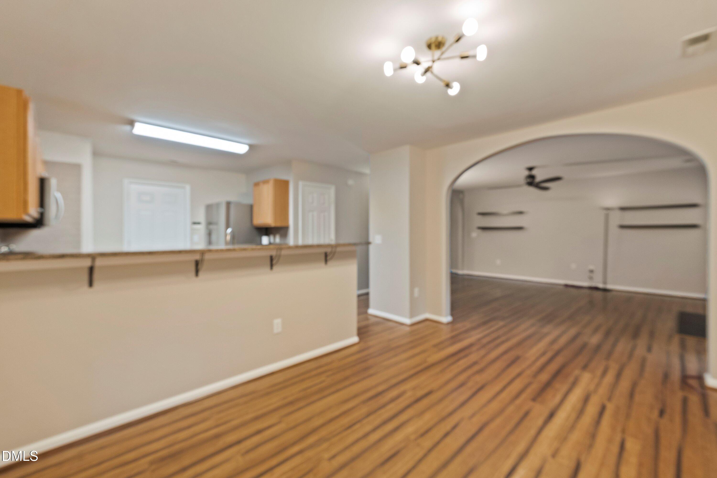 11 Kinglet Court Durham, NC 27713 - Photo 9 of 32 a view of a kitchen with wooden floor and a sink