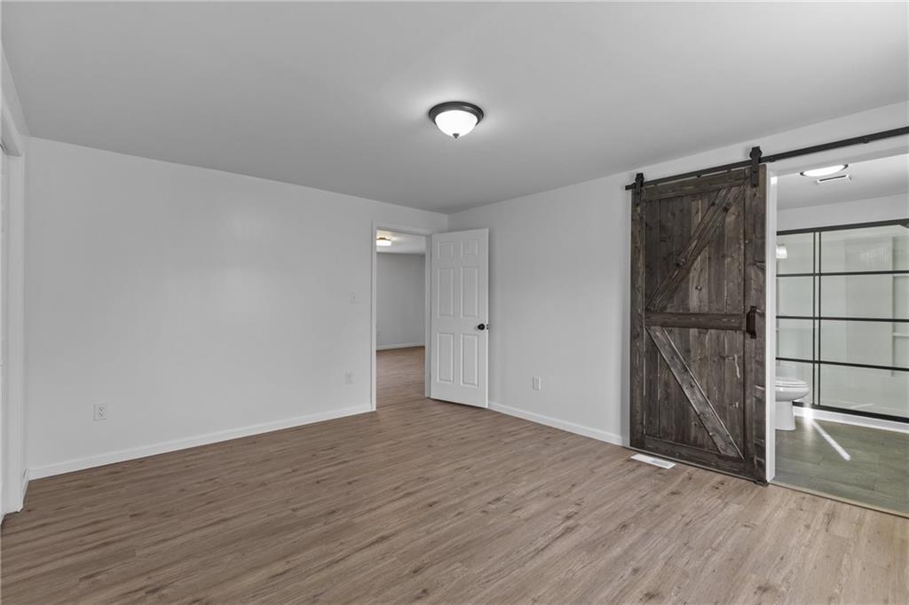 269 Derbytown Road Latrobe, PA 15650 - Photo 16 of 32 Main floor primary with view of bathroom.